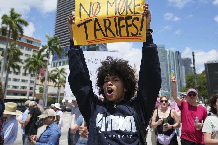 Paul Ivanov chants during a protest against the Trump administration on Saturday in Miami.