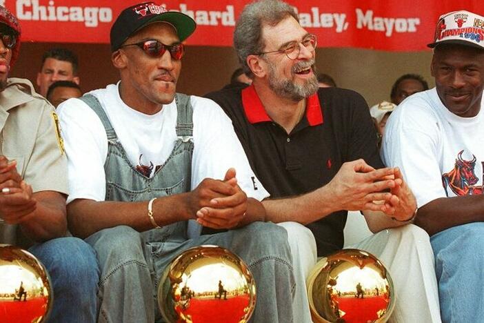 Chicago Bulls Dennis Rodman, Scottie Pippen, coach Phil Jackson and Michael Jordan celebrating their 4th NBA championship in 1996. Chicago's dominance of basketball in the 1990s established the Bulls as a cultural force and worldwide brand.