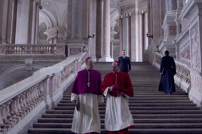 Cardinal O'Malley (Brían F. O'Byrne) and Cardinal Lawrence (Ralph Fiennes) confer in <em>Conclave. </em>