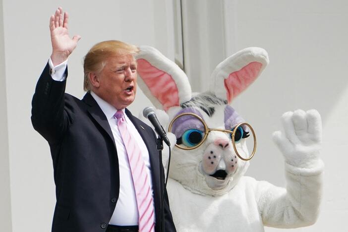President Trump and the Easter Bunny wave during the annual White House Easter Egg Roll on the South Lawn on April 22, 2019.