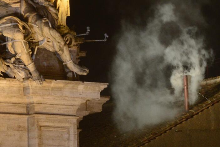 White smoke billows from a chimney at the Sistine Chapel, signaling that cardinal electors have chosen a new pope — Pope Francis — on March 13, 2013.