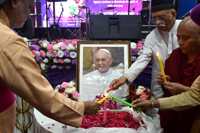 People attend an interfaith memorial meeting to mourn the death of Pope Francis in New Delhi, India, on Monday.