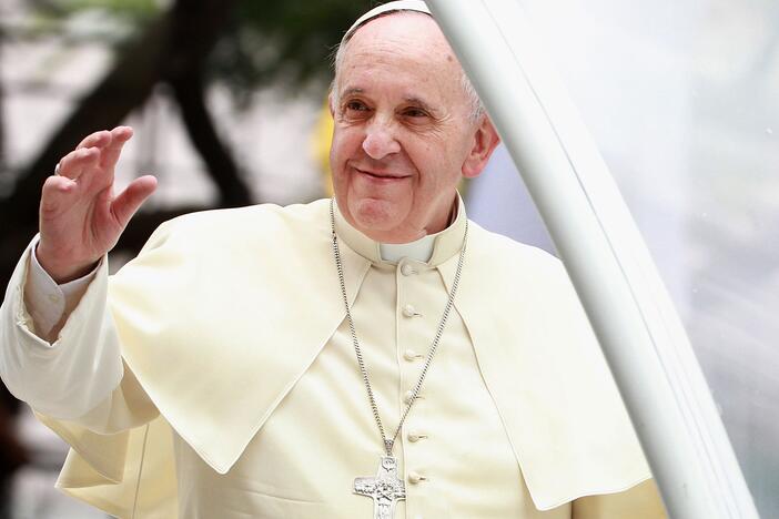 Pope Francis waves to thousands of followers as he arrives at the Philippines' Manila Cathedral on Jan. 16, 2015. During his papacy, Francis strove to reach out to what he called the "periphery" of the world in Asia, Africa and Latin America.