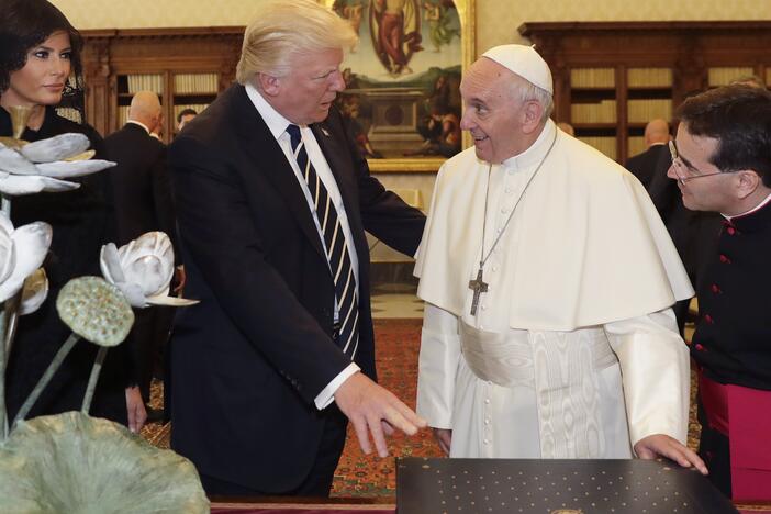 Pope Francis exchanges gifts with US President Donald Trump (C) and US First Lady Melania Trump during a private audience at the Vatican on May 24, 2017. US President Donald Trump met Pope Francis at the Vatican today in a keenly-anticipated first face-to-face encounter between two world leaders who have clashed repeatedly on several issues.
