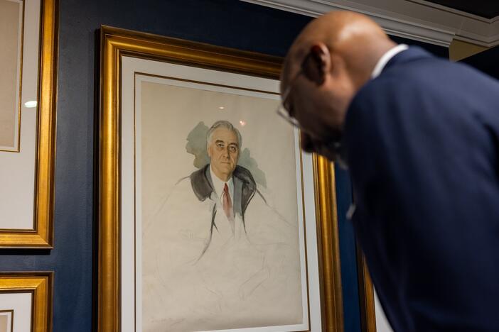 U.S. Senator Raphael Warnock looks at the unfinished portrait of former President Franklin D. Roosevelt.  FDR was sitting for the portrait at his retreat in Warm Springs, Ga., on April 12, 1945, when he suffered a stroke and died.