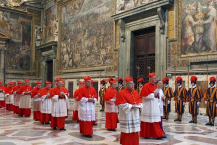 In this photo from files taken on April 18, 2005, and released by the Vatican paper <em>L'Osservatore Romano</em>, Cardinals walk in procession to the Sistine Chapel at the Vatican, at the beginning of the conclave.