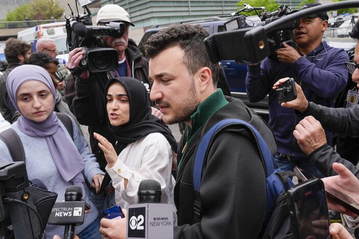 Mahmoud Khalil, center, and his wife Noor Abdalla, left, in violet headscarf, at Columbia University last year.