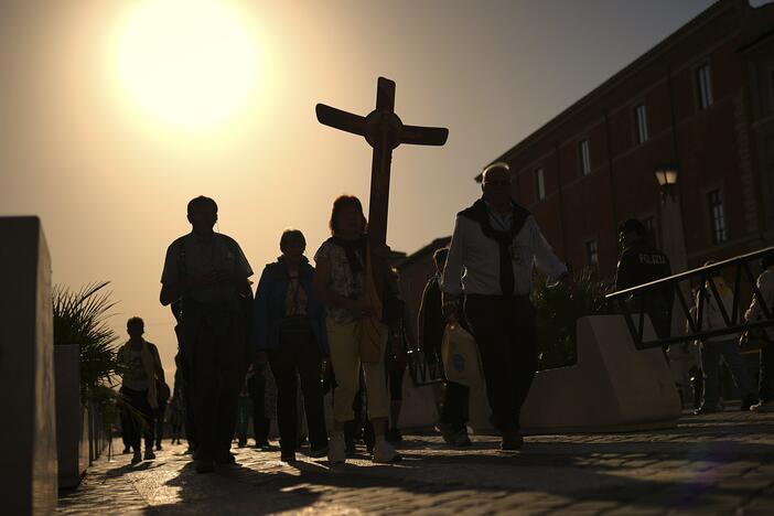 Pilgrims arrive in St. Peter's Square at the Vatican, Tuesday, April 22, 2025.