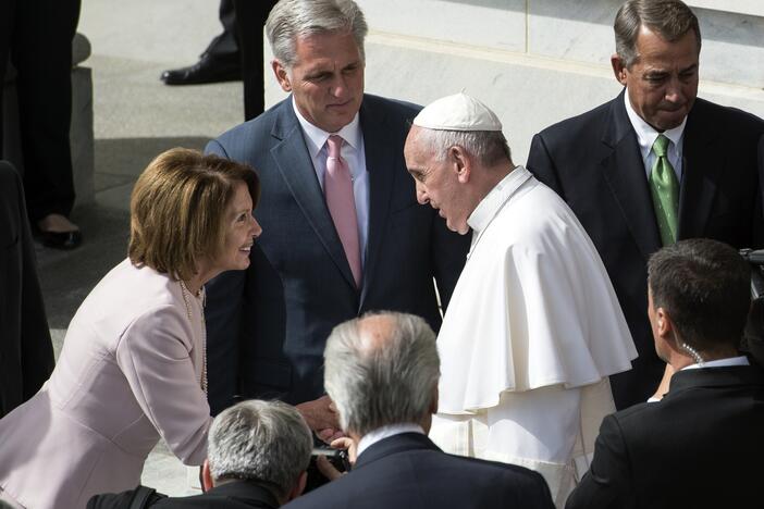 Rep. Nancy Pelosi shakes hands with Pope Francis on Capitol Hill in September 2015.