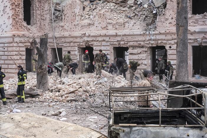 Rescue workers clear the rubble of a building hit by a Russian missile strike on Sumy, Ukraine on April 13.