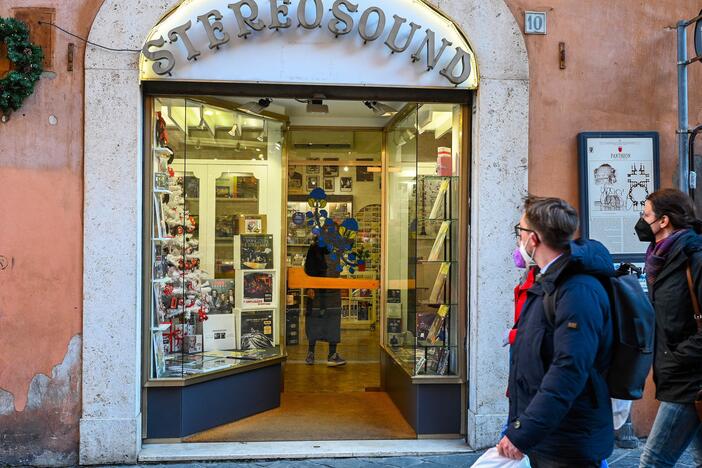 Pedestrians walk past Stereosound, the record store in Rome that the late Pope Francis used to frequent before his papacy. The pontiff visited the shop in 2022 to bless it following a renovation.