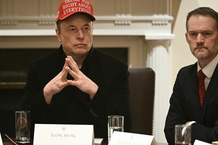 Elon Musk and U.S. Trade Representative Jamieson Greer listen during a cabinet meeting in White House on March 24,.