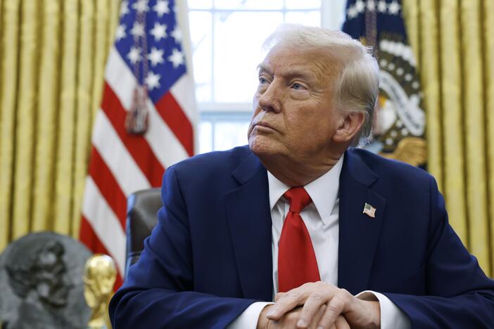 President Donald Trump speaks to reporters in the Oval Office in February.