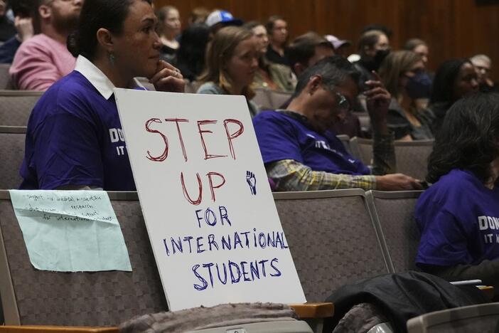 Students and educators attend a rally at Northwestern University one week before the Trump administration said it will restore the records of international students deleted from a crucial database. That move had thrown into doubt many students' ability to stay in the U.S.