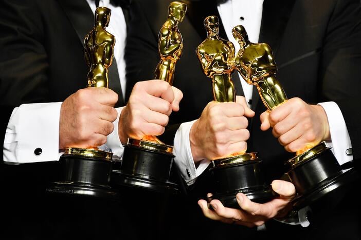 Academy members now have to watch all the nominated films in a category if they want to cast a final-round vote. Above, Oscar winners pose with their awards in 2017.
