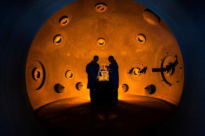 Workers stand inside a special chamber at Lawrence Livermore National Laboratory. The chamber is used to test new conventional explosives that initiate detonation of advanced nuclear weapons designs. The data produced from such experiments is considered restricted.