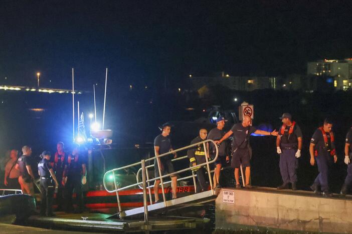 Rescue workers gather at the Seminole Boat ramp north of where a boat crashed into the ferry causing multiple injuries near the Clearwater Memorial Causeway Bridge, on Sunday, April 27, 2025, in Clearwater, Fla.