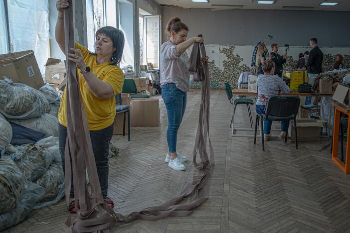 Displaced Ukrainians weave camouflage netting for the military in Zaporizhia Youth Center on March 19.