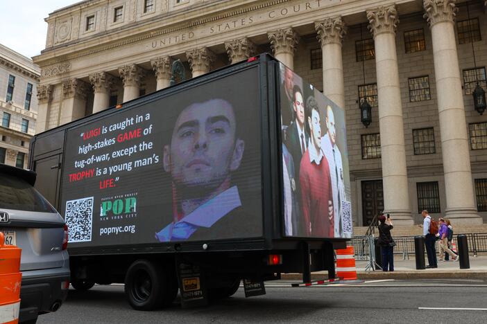A truck displays pictures of Luigi Mangione on April 25, 2025 in New York City, as he was set to appear for the arraignment on charges that he murdered the CEO of UnitedHealthcare last year.