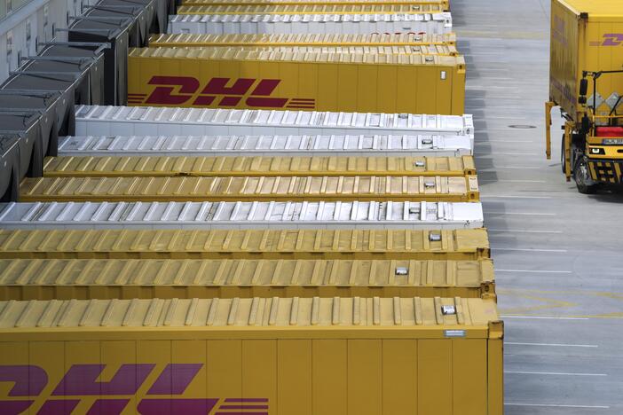 A transfer truck arrives at a DHL facility in Ludwigsfelde near Berlin, Germany, in May 2022. The company said this week it would resume shipping packages over $800 to individual U.S. customers.