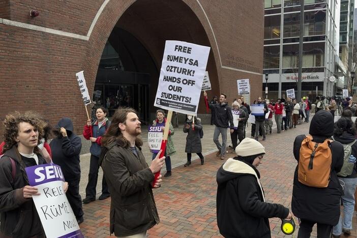 Protesters gather outside federal court during a hearing with lawyers for Rumeysa Ozturk, a Tufts University doctoral student from Turkey who was detained by immigration authorities, in Boston.