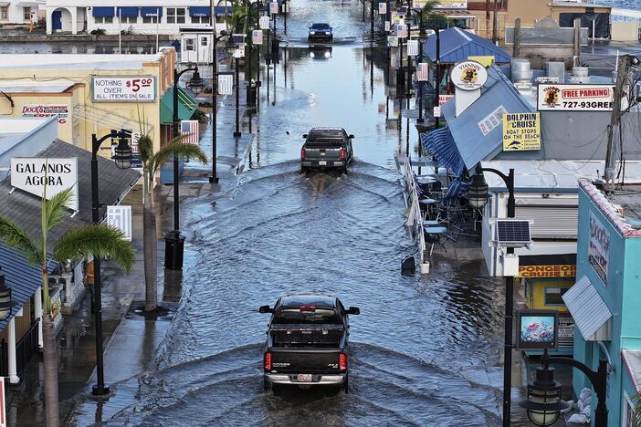 Flood waters in Tarpon Springs, Fla., after Hurricane Helene passed offshore in September 2024. Sea level rise due to climate change means coastal flooding is worse, and happens more often. The White House has dismissed approximately 400 scientists and other climate experts who were working on a major report about how climate change affects the U.S.