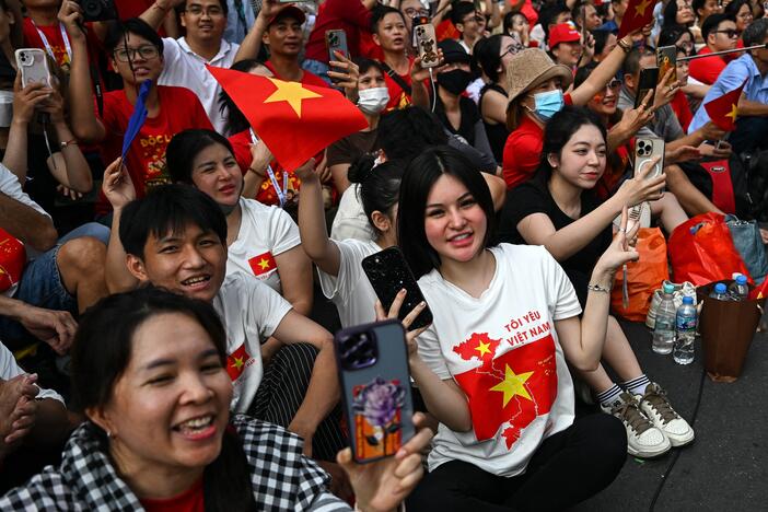 Spectators cheer as Chinese soldiers march during a parade marking the 50th anniversary of the fall of Saigon and the end of the Vietnam War in Ho Chi Minh City on April 30, 2025.