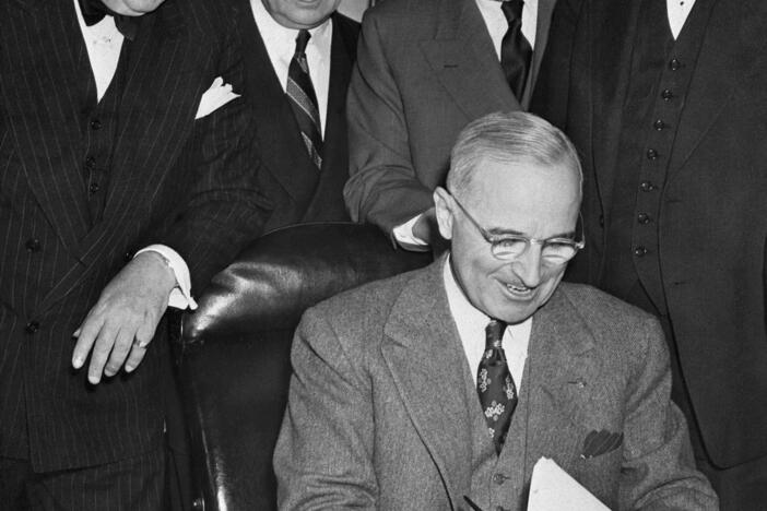 President Harry Truman signs the Marshall Plan on April 3, 1948, in Washington. The plan played a key role in the reconstruction of Europe after World War II and was part of the wide-ranging moves by the U.S. to establish a new international order that still defines the world to this day.