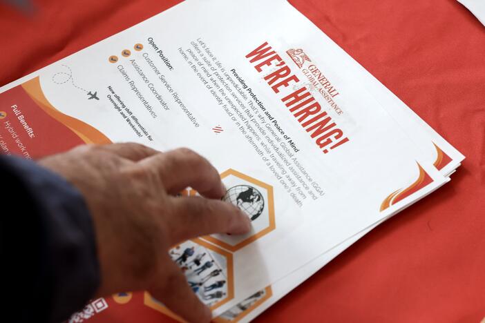 A 'we're hiring' pamphlet at the Mega JobNewsUSA South Florida Job Fair at the Amerant Bank Arena in Sunrise, Fl., on April 30, 2025. Employers continued to add jobs in April, even as Trump's trade war took a toll on economic growth.