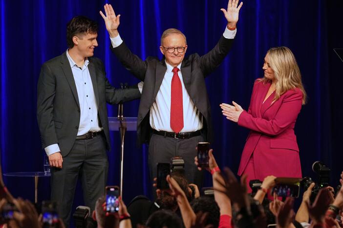 Australian Prime Minister Anthony Albanese (center), his partner Jodie Haydon and son Nathan react as they meet the party faithful after winning a second term following the general election in Sydney on Saturday.