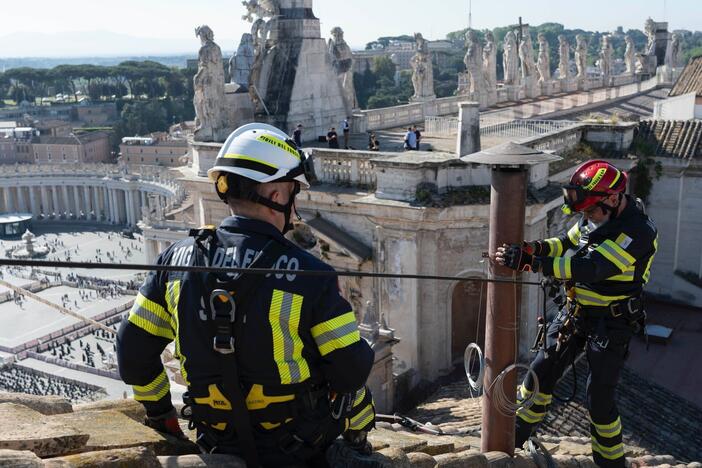 Workers have completed the installation of the chimney on top of the Vatican building in Rome, Italy. The color of the chimney smoke will give hints to the public about how the papal selection process is going.