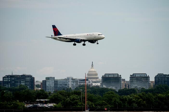 A Delta Air Lines flight approaches Ronald Reagan Washington National Airport in Arlington, Va., on July 2, 2022. On Thursday, two commercial jetliners had to abort landings this week at the airport because of an Army Black Hawk helicopter.