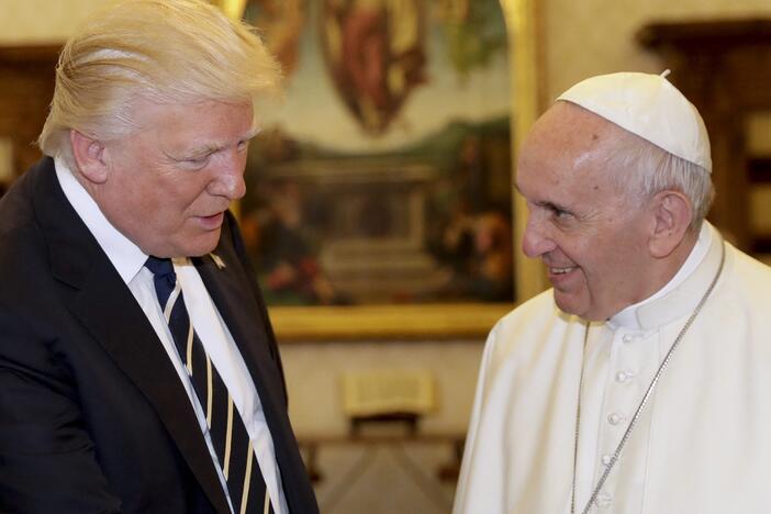 President Trump is pictured at the Vatican in 2017 with Pope Francis, who died last month.  Trump posted on social media Friday what appears to be an AI-generated image of himself dressed as the pope.