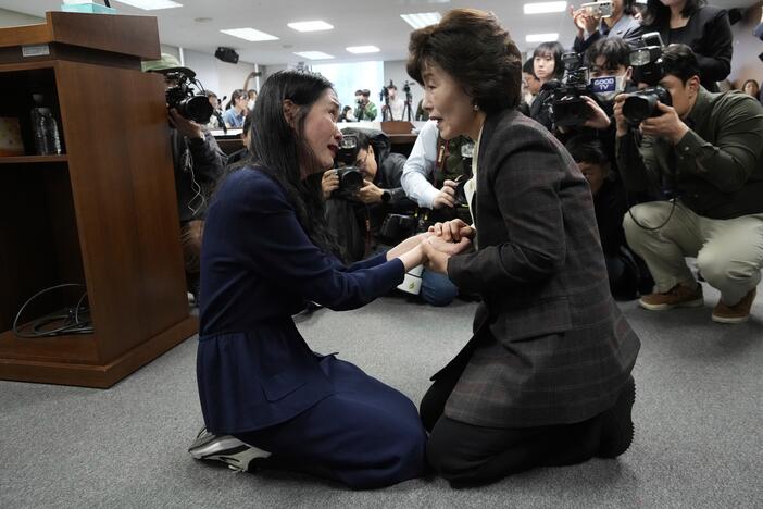 Truth and Reconciliation Commission Chairperson Park Sun Young (right) comforts adoptee Yooree Kim during a press conference in Seoul, South Korea, March 26.