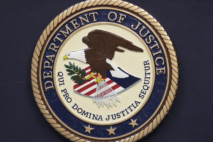 The Department of Justice seal is seen during a news conference Thursday, Dec. 5, 2024, in Memphis, Tenn.