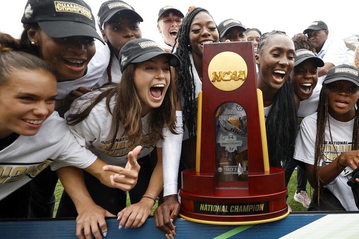 University of Florida athletes celebrate the women's team title during the NCAA Division 1 Outdoor Track & Field Championships on June 11, 2022. Under a proposed legal settlement, many athletes on track and field, swimming and other collegiate sports could see their roster spots eliminated.