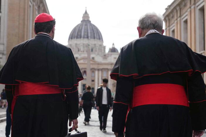 Canadian Cardinal Thomas Christopher Collins (right) and Cardinal Francis Leo walk on Via della Conciliazione street near the Vatican, with St. Peter's Basilica in the background, in Rome on Monday.