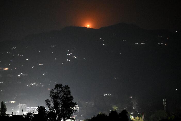 A flare rises in the air over the hill near the main town of Poonch district, India, on Wednesday. India said it carried out "precision strikes at terrorist camps" inside Pakistan and Pakistani-administered Kashmir, days after it accused Pakistan of involvement in a deadly militant attack on the Indian-administered side of Kashmir.