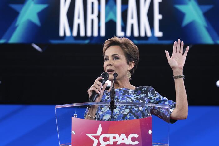 Senior Trump adviser Kari Lake, shown above at a conservative conference earlier this year, announced Tuesday night that Voice of America would rely on coverage from the far-right television network OAN. Voice of America employees that Lake put on indefinite leave are suing to be restored to their jobs.
