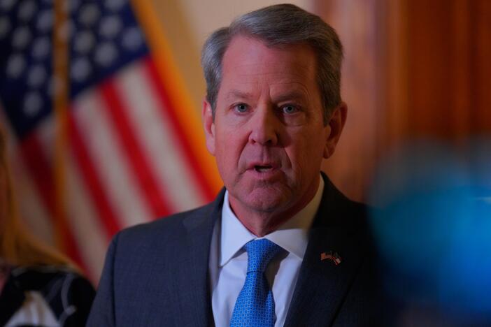 Georgia Gov. Brian Kemp speaks to the press at the Georgia State Capitol after signing a religious freedom bill into law on Friday, April 4.