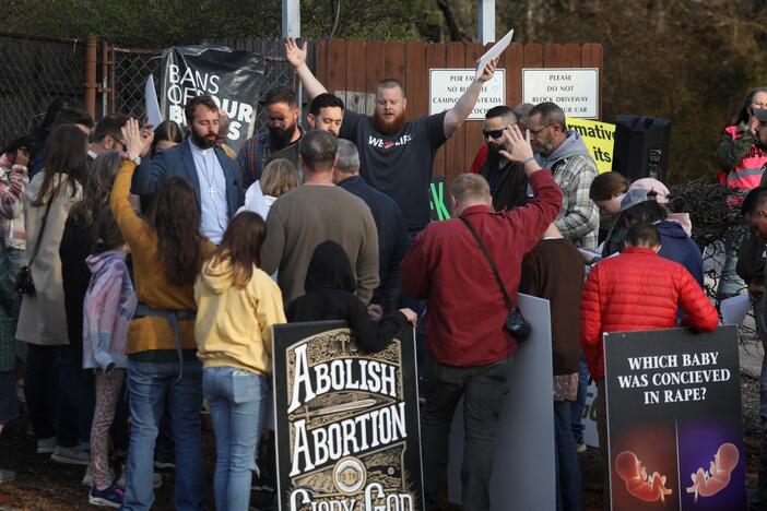 Anti-abortion activists pray and protest in front of the Greenville Women's Clinic in Greenville, S.C., in March.