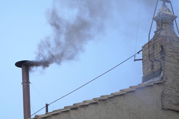 Black smoke billows from the chimney of the Sistine Chapel during the conclave to elect a new pope, at the Vatican, Thursday, May 8, 2025.