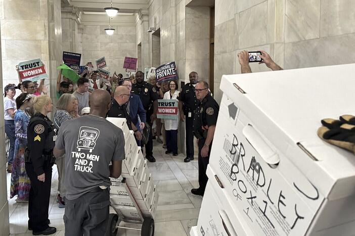 Boxes containing signatures supporting a proposed ballot measure to scale back Arkansas' abortion ban are delivered to the state Capitol in Little Rock, Ark., on July 5, 2024. Arkansas lawmakers this year passed new restrictions on citizen-led ballot measures.