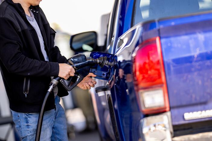 A man stops to fill up his car at a gas station in Washington, D.C., in November. Gas prices have fallen this spring, despite the fact that they typically rise this time of year, largely because of lower oil prices. That saves drivers money and also brings down the costs of goods.