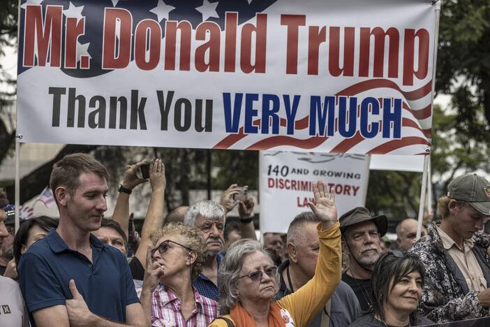 Afrikaan South Africans supporting US President Donald Trump and South African and US tech billionaire Elon Musk gather in front of the US Embassy in Pretoria, on February 15, 2025 for a demonstration.
