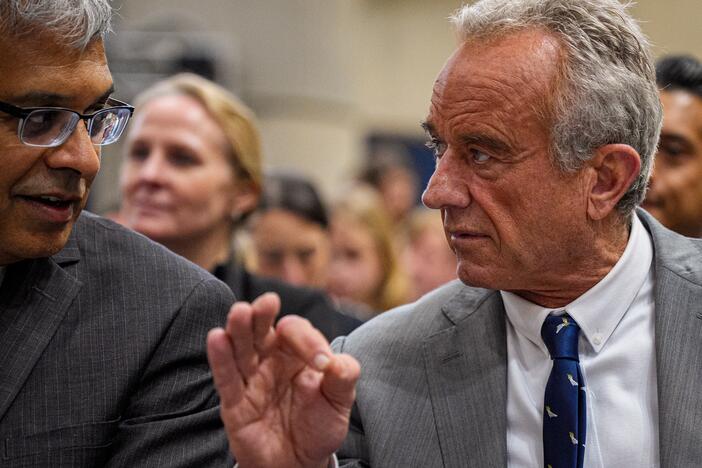 NIH Director Jayanta Bhattacharya, left, and Health and Human Services Secretary Robert F. Kennedy Jr. speak before a news conference at the Health and Human Services Department on April 22.