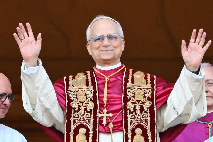Pope Leo XIV greets the public for the first time from the main balcony of St. Peter's Basilica.