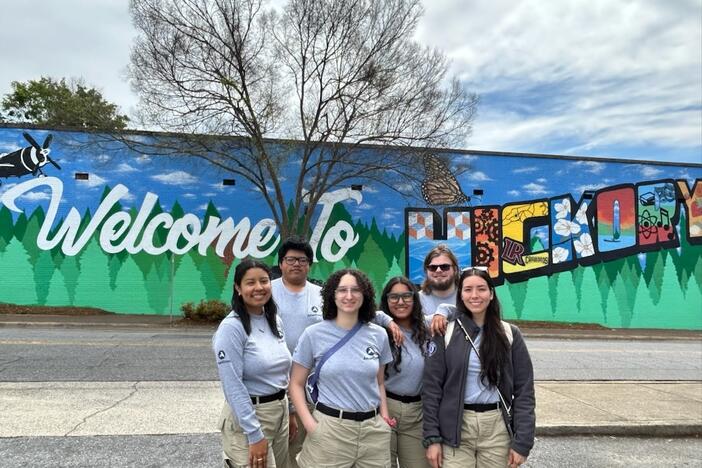 Brandon Fernandez, second from left, with AmeriCorps colleagues in North Carolina this year, where they were helping with disaster recovery after Hurricane Helene. He and others struggled to hold back tears when their deployment was cut short.