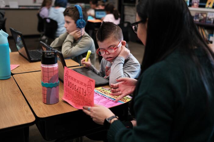 Kellen and his classmates, including his best friend, Nolan Robbins (left), learn about the structure of the U.S. government with teacher Robyn Fox.