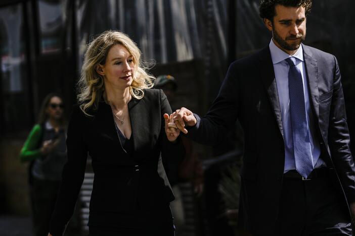 Former Theranos CEO Elizabeth Holmes and her partner, Billy Evans, following a hearing at the Robert E. Peckham U.S. Courthouse on March 17, 2023 in San Jose, California. Evans has raised millions of dollars for a new health tech startup that Holmes is advising him on.